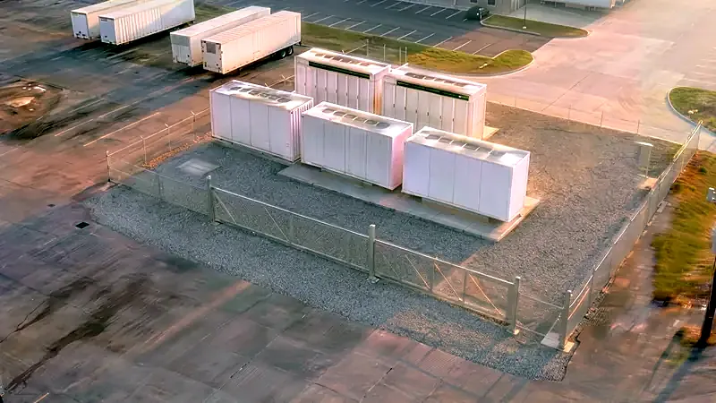 Rendered view of the battery enclosures set on their piers, electrical corner still empty.