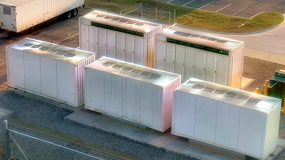 Rendered detail of containerized battery enclosure rows behind a perimeter fence.